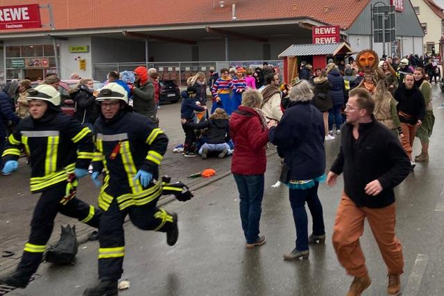 People react at the scene after a car ploughed into a carnival parade injuring several people in Volkmarsen, Germany February 24, 2020.     Elmar Schulten/Waldeckische Landeszeitung via REUTERS.     