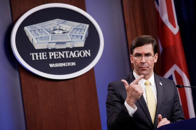 FILE PHOTO: U.S. Defense Secretary Mark Esper gestures as he speaks during a joint news conference with Britain's Secretary of State of Defence Ben Wallace after their meeting at Pentagon in Arlington, Virginia, U.S., March 5, 2020. REUTERS/Yuri Gripas