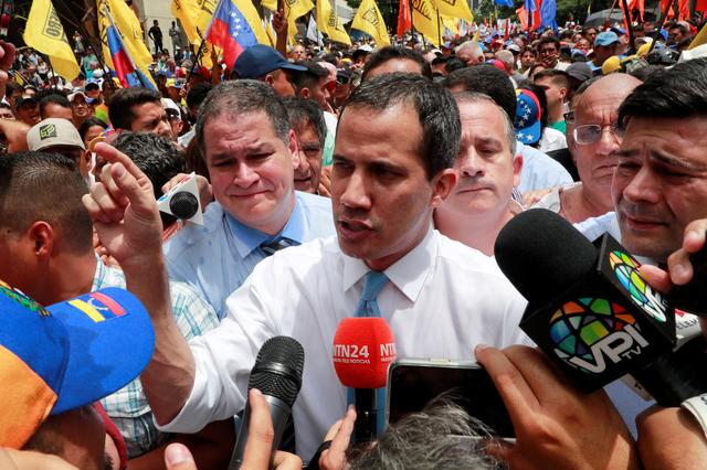 FILE PHOTO: Venezuela's National Assembly President and opposition leader Juan Guaido, who many nations have recognised as the country's rightful interim ruler, talks to the media as he takes part in a demonstration in Caracas, Venezuela March 10, 2020. REUTERS/Carlos Jasso/File Photo