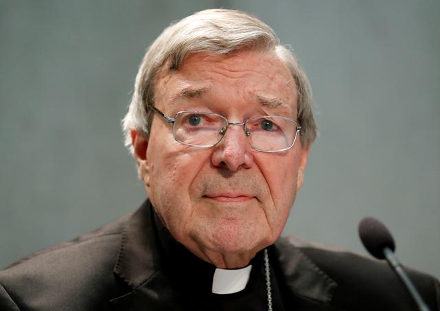 FILE PHOTO: Cardinal George Pell attends a news conference at the Vatican, June 29, 2017. REUTERS/Remo Casilli/File Photo