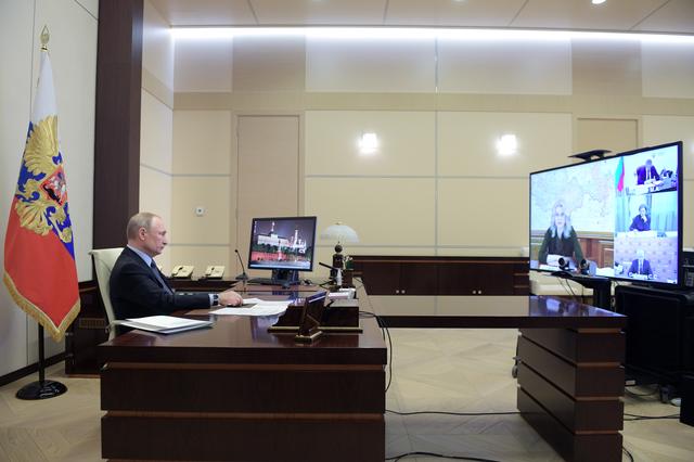 Russian President Vladimir Putin chairs a meeting on the situation with the spread of the coronavirus disease (COVID-19) in Russia via video link, at the Novo-Ogaryovo state residence outside Moscow, Russia April 13, 2020. Sputnik/Alexei Druzhinin/Kremlin via REUTERS 