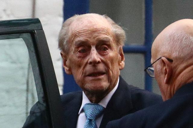 FILE PHOTO: Britain's Prince Philip enters a car as he leaves the King Edward VII's Hospital in London, Britain December 24, 2019. REUTERS/Hannah McKay