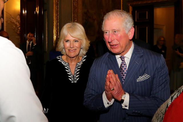 FILE PHOTO: Britain's Prince Charles and Camilla, Duchess of Cornwall attend the Commonwealth Reception at Marlborough House, in London, Britain March 9, 2020. Aaron Chown/Pool via REUTERS