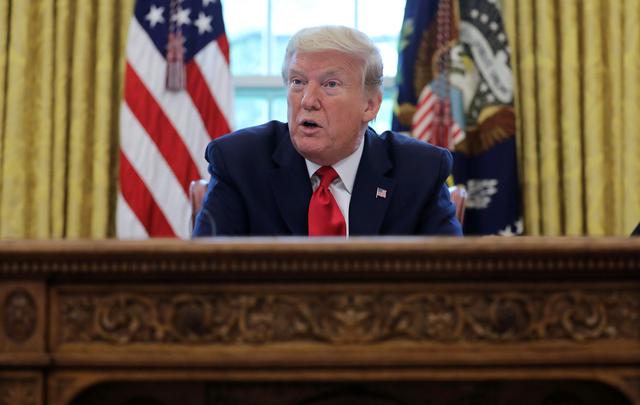 U.S. President Donald Trump answers questions during an interview with Reuters about the novel coronavirus (COVID-19) pandemic and other subjects in the Oval Office of the White House in Washington, U.S., April 29, 2020. REUTERS/Carlos Barria