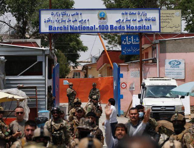 Afghan security forces stand guard outside Dasht-e-Barchi Hospital which came under attack in Kabul, Afghanistan May 12, 2020. REUTERS/Mohammad Ismail