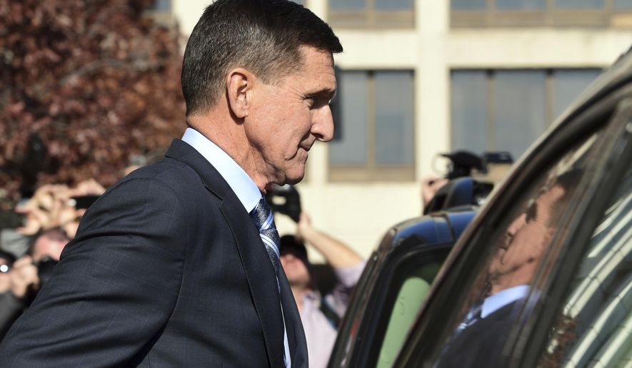 FILE - In this Dec. 1, 2017, file photo, former President Donald Trump national security adviser Michael Flynn leaves federal court in Washington. The Justice Department's dismissal of the Michael Flynn case has been swept up in a broader push by President Donald Trump and Republican allies to reframe the Russia investigation as a plot to sabotage his administration. (AP Photo/Susan Walsh, File)