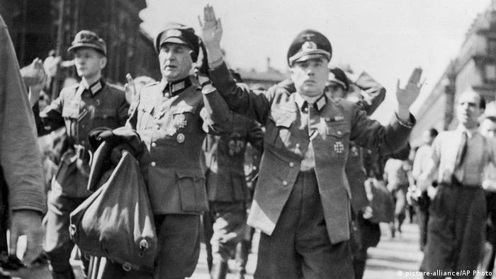 In this August 28, 1944, file photo, high-ranking German officers captured by French patriot forces in Paris are marched through the streets of the French capital with their hands in the air