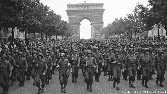 US troops march down the Champs Elysees in Paris, France, on August 29, 1944, after the city's liberation
