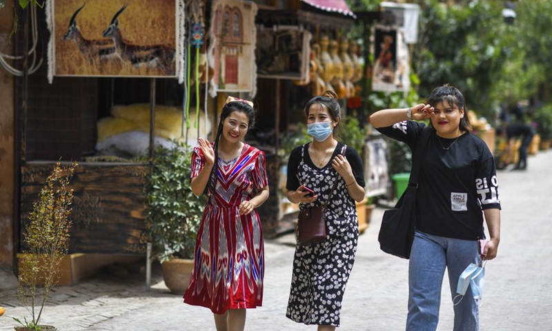 Local residents walk in a street at a scenic spot in the ancient city of Kashgar, northwest China's Xinjiang Uygur Autonomous Region, May 16, 2020.Photo:Xinhua Local residents walk in a street at a scenic spot in the ancient city of Kashgar, northwest China's Xinjiang Uygur Autonomous Region, May 16, 2020.Photo:Xinhua