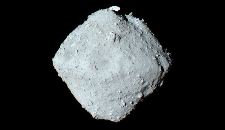 A view of Ryugu from space, showing it's roughly square shape. 